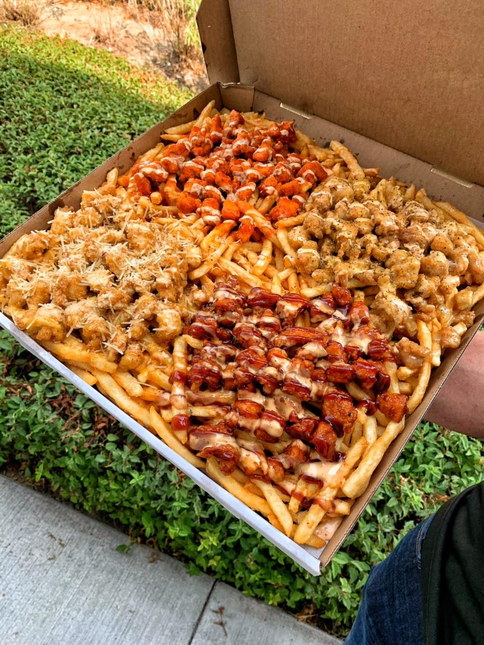 Boss Fries are back: a pizza box filled with fries, chicken and four sauces.